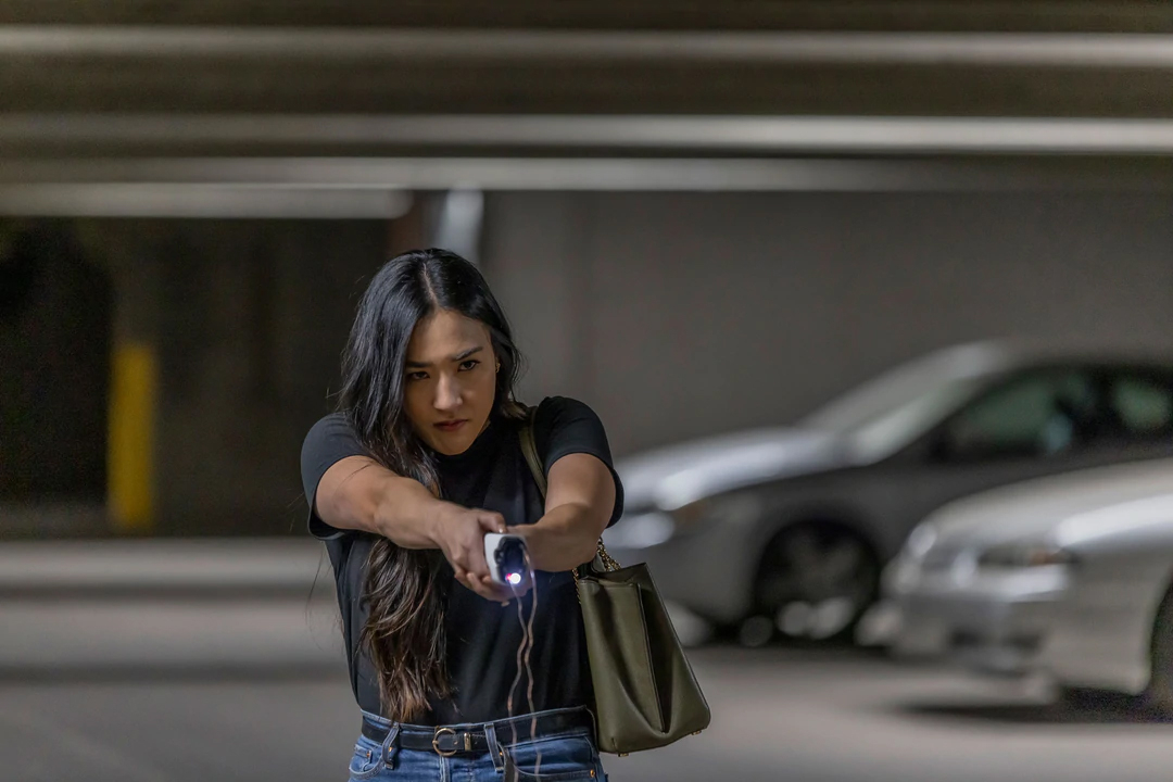 Woman firing Taser Bolt 2